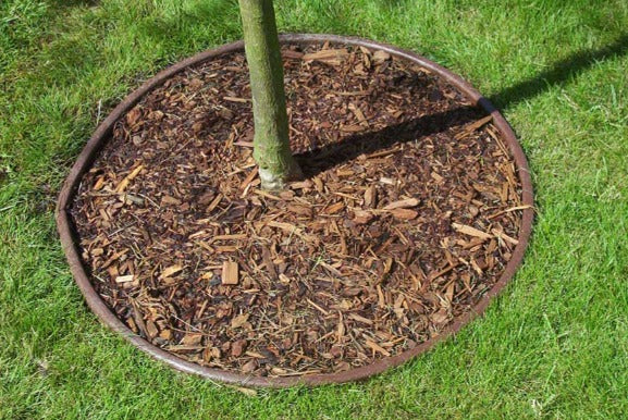 Tablero doblador de plástico color teca con 4 estacas (3,3" x 16'ft) (1 paquete)